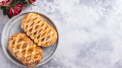 Pastries with apples on a plate. Space for text. Top view