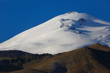 Cloudless sky over the snowy peak of Mount Elbrus, North Caucasus.