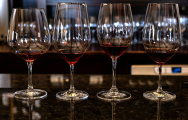Four Crystal Glasses Filled With Red Wine in a Winery Tasting Room