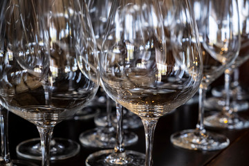 Closeup of Empty Wine Glasses in Various Shapes on a Bar Table
