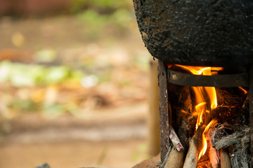 Villagers cooking in the morning using firewood as a fuel for camping.