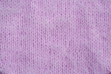 Knitted warm violet winter sweater. Huggy style. Top view, flat lay.Top view, flat lay.