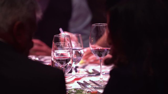 A formal event, celebration, wedding, fund raiser or gala with champagne, wine and other beverages on a table