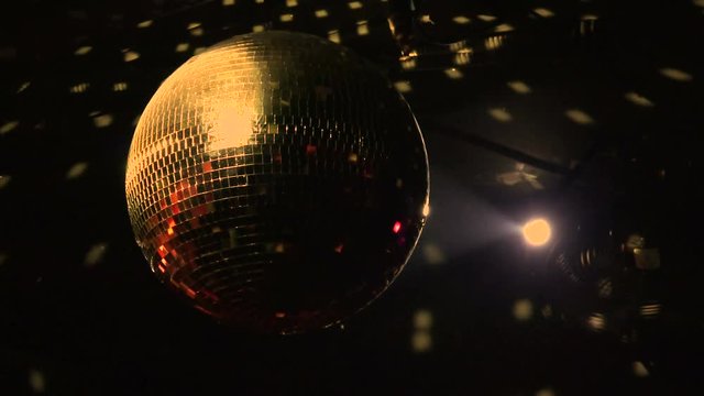 Closeup of a disco ball reflecting light in a nightclub