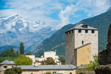 watch tower at the ancient Roman remains of the city of Aosta and in the background the Mont Blanc - Italy