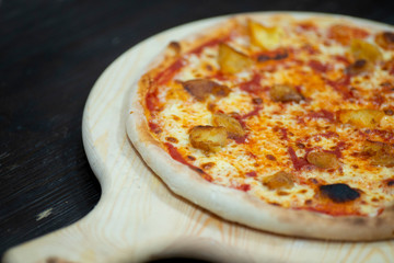 pizza on wooden pan Send 