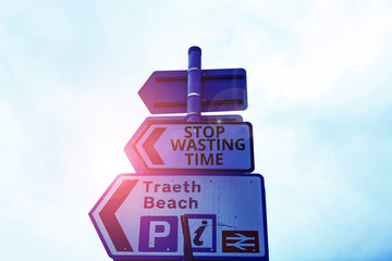 Writing note showing Stop Wasting Time. Business concept for advising demonstrating or group start planning and use it wisely Business concept with empty copy space on the road sign