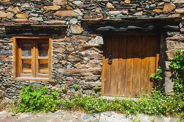An entrance in an old flagstone house in Portugal