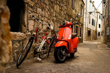 Fototapeta na wymiar Vespa and bicycle in the Croatia street