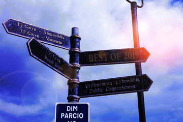 Writing note showing Best Of 2019. Business concept for great and marvelous things and events happened on 2019 Road sign on the crossroads with blue cloudy sky in the background