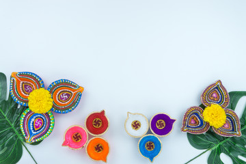 Indian festival Diwali, Diya oil lamps lit on colorful rangoli. Hindu traditional. Happy Deepavali. Copy space for text.