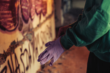 Fototapeta na wymiar Young urban painter starting to draw graffiti on the wall