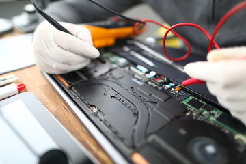Male hands in white protective glove hold