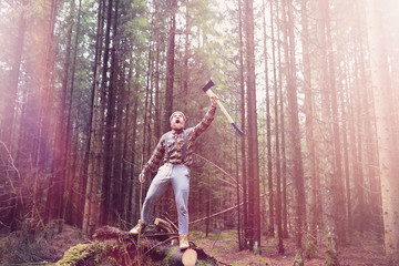 A bearded lumberjack with a large ax - obrazy, fototapety, plakaty