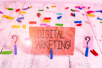 Text sign showing Digital Marketing. Business photo text market products or services using technologies on Internet Scribbled and crumbling sheet with paper clips placed on the wooden table