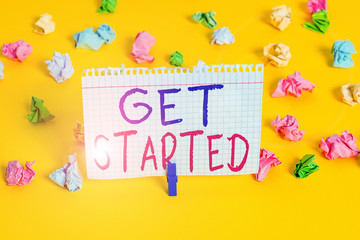 Word writing text Get Started. Business photo showcasing asking someone to begin task endeavour or process right now Colored crumpled papers empty reminder white floor background clothespin