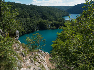 Fototapeta premium Croatia, august 2019: Plitvice lakes, famous world tourist heritage sight, waterfall and green nature