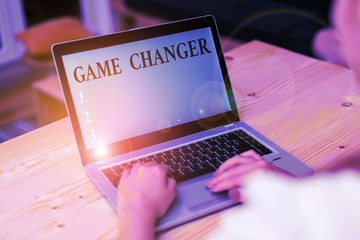 Word writing text Game Changer. Business photo showcasing Sports Data Scorekeeper Gamestreams Live Scores Team Admins woman laptop computer smartphone mug office supplies technological devices
