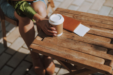 Woman is taking hot drink in cafe