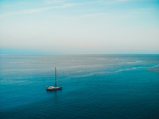 Fototapeta premium created by dji cameralone sailing boat in the ocean