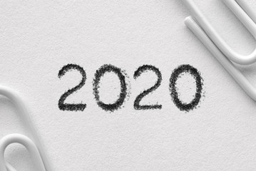 White plastic paper clips with December word