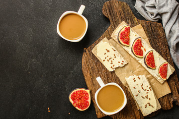 healthy food, sandwich, crisp bread, figs, coffee (breakfast or snack, cream cheese, butter, yogurt) menu concept. food background. copy space. Top view