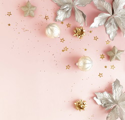 Christmas background banner. Xmas or new year silver color decorations on pastel pink background with empty copy space for text.  holiday and celebration concept for postcard or invitation. top view 