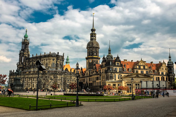 Fototapeta na wymiar Dresden Cathedral of the Holy Trinity Hofkirche and Dresden Castle Hausmannsturm on Theaterplatz in Dresden, Germany.