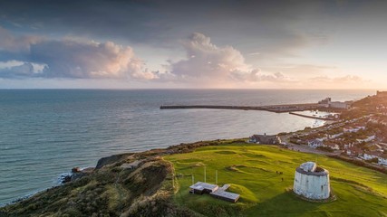 Folkestone's Martello Tower and Harbour Arm just before sunset - obrazy, fototapety, plakaty