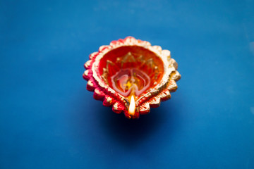Colorful clay diya lamps lit during diwali celebration