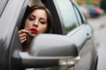 Obraz na płótnie Canvas Girl driving a car bad emotions
