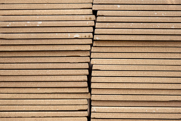 Stack of floor tiles close up abstract background.