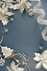Christmas background. Xmas or new year white silver color decorations on blue gray  background with empty copy space for text.  holiday and celebration concept for postcard or invitation. top view 