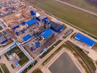 Fototapeta premium Construction of a plant for the production of carbon black. Future environmental problems of environmental pollution. Shooting drone from the air.