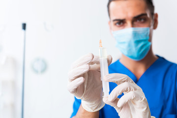Fototapeta premium Young male doctor working in the clinic