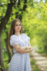 Fototapeta premium A girl in a spring green park