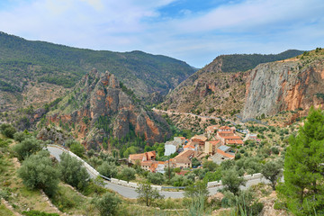 Fototapeta na wymiar Landscape view of the town of Ayna and the Picarzos rock from the mountain road that descends to that town, Albacete province, Castilla la Mancha, Spain
