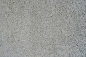 Smooth seamless texture of a terry towel. Gray color
