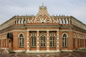 Fototapeta na wymiar brick pink Palace in Tsaritsyno Park on autumn day in Moscow Russia