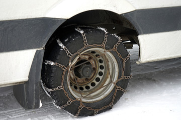 Car with mounted snow chain.