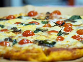 blurred pattern of homemade pizza. Italian traditional dish on a thin dough with a variety of fillings