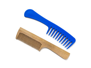 Two combs, wooden and blue plastic, on a white background