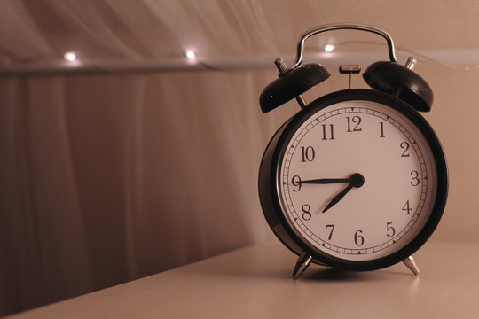 vintage alarm clock on the table