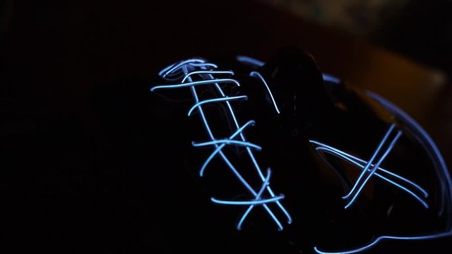 Scary / creepy glowing LED  mask. Close up slow motion footage.