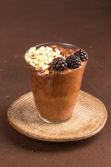 Dark chocolate mousse with blackberries and roasted hazelnuts