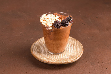 Dark chocolate mousse with blackberries and roasted hazelnuts