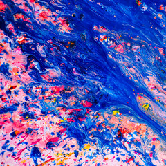 Abstract blue and pink painting on canvas using liquid acrylic technique. Marble slice texture