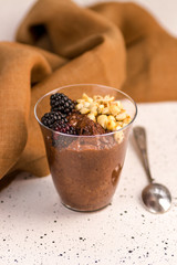 Dark chocolate mousse with blackberries and roasted hazelnuts
