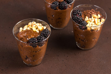 Dark chocolate mousse with blackberries and roasted hazelnuts