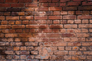 Texture of old brickwork with peeling color paint